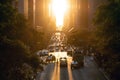 Traffic congestion with cars, taxis and buses on 42nd Street in Midtown Manhattan New York City with sunset shining between Royalty Free Stock Photo