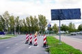 Traffic constraints during street repairs, warning signs