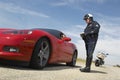 Traffic Cop Talking With Driver Of Sports Car Royalty Free Stock Photo