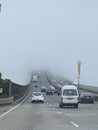 Traffic on the motorway disappears into the fog