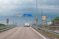 Traffic crossing off motorway with roadsigns