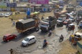 Traffic on damaged road with potholes in the city, Pune