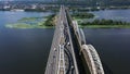 Traffic on the Darnytsky Bridge over the river Dnipro in Kyiv - aerial shot