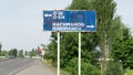 Traffic directional sign showing Osh and Narimanov directions