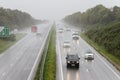 Traffic driving in heavy rain on dual carriageway Royalty Free Stock Photo