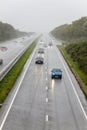 Traffic driving in rain on dual carriageway