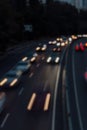 Traffic on highway, blurred motion. Traffic jam in evening city, defocused. Cars in motion with lights, high angle view Royalty Free Stock Photo