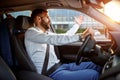 Traffic jam - stressed businessman driving car