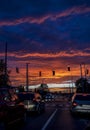 Traffic jam in city at colorful cloudy sky