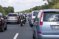 Traffic jam on a German highway, two bikes between the cars Royalty Free Stock Photo