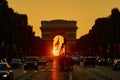 Traffic jam in Paris on Champs-Elysees street with Triumphal Arch Royalty Free Stock Photo