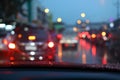 Traffic jam on night road city with storm rainy day weather, car driving on street town Royalty Free Stock Photo