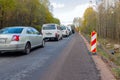 Traffic jam on a rural asphalt road due to the repair of the roadway