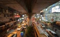 Traffic jam in the rush hour on highway bridge after finish an event. Busy cars on bridges and roads in Siam Discovery in Bangkok Royalty Free Stock Photo