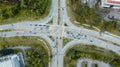 Traffic junctions, modern city. View from above to busy road junction in Malaysia. Colorful cars and trucks driving straight