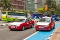 Traffic in Kuala Lumpur. Colorful vehicles cars taxis and buses