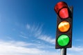 Traffic Light against a Blue Sky with Clouds and Copy Space Royalty Free Stock Photo