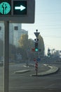 Traffic light with arrow in the city with green signal on the background of the road Royalty Free Stock Photo