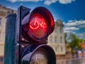 Traffic light for bicycles with red light as a sign of prohibited passage closeup