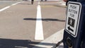 Traffic light button on pedestrian crosswalk, people have to push and wait. Traffic rules and regulations for public safety in USA