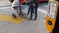 Traffic light button on pedestrian crosswalk, people have to push and wait. Traffic rules and regulations for public safety in USA Royalty Free Stock Photo