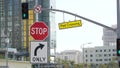 Traffic light and caution sign, road intersection in USA. Transportation safety, rules and regulations symbol. Driveway crossing