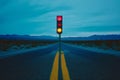 Traffic light on desert road with distant mountains in the distance Royalty Free Stock Photo
