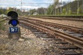 Traffic light in front of the railway turnouts Royalty Free Stock Photo