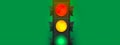 Traffic light on green background. International Traffic Light Day. Banner. Close-up. Copy space. Generative AI content. Royalty Free Stock Photo