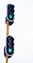 Traffic light, green and city intersection on street for go instruction, transportation or downtown. Road safety Royalty Free Stock Photo