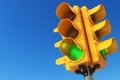 Traffic light with green color on blue sky background. Royalty Free Stock Photo