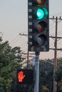 A traffic light on green indicatiing go, and pedestrian walk light red Royalty Free Stock Photo