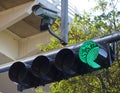 Traffic light in green with security cam Royalty Free Stock Photo