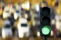 Traffic light green signal and cars