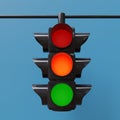 Traffic light hanging with all three color, red, orange, green on blue background. 3d render Royalty Free Stock Photo