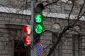 Traffic light at the intersection with red and green lights and a road sign Royalty Free Stock Photo