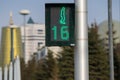 Traffic light located within city limits shows green permissive signal for crosswalk traffic. Time timer shows remaining