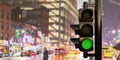 Traffic Light on pole, semaphore with green go signal on blur city at night background. 3d render