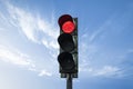 Traffic light in red color, with sky background Royalty Free Stock Photo