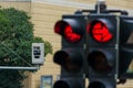 Traffic light with red light camera Royalty Free Stock Photo