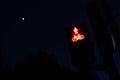 Traffic light with red lights for pedestrians and cyclists, with figure of a cyclist. Night background for the concept of stopping Royalty Free Stock Photo