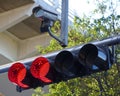 Traffic light in red with security cam Royalty Free Stock Photo