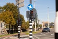 Traffic light-regulated intersection with road signs. Red traffic light Royalty Free Stock Photo