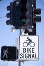 Traffic light and road sign for cyclists and pedestrians Royalty Free Stock Photo