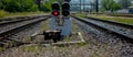 Traffic light shows red signal on railway. Red light. Railway tracks with red light semaphore