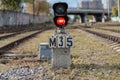 Traffic light shows red signal on railway. Railway station Royalty Free Stock Photo