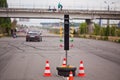 Traffic light at the start of a racing track with a car in the distance Royalty Free Stock Photo