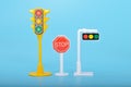 Traffic light toys and stop sign isolated on a blue background