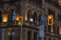 Traffic lights against historical building in downtown Ottawa, Canada at night Royalty Free Stock Photo