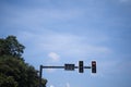 Traffic lights on the bright blue sky background Royalty Free Stock Photo